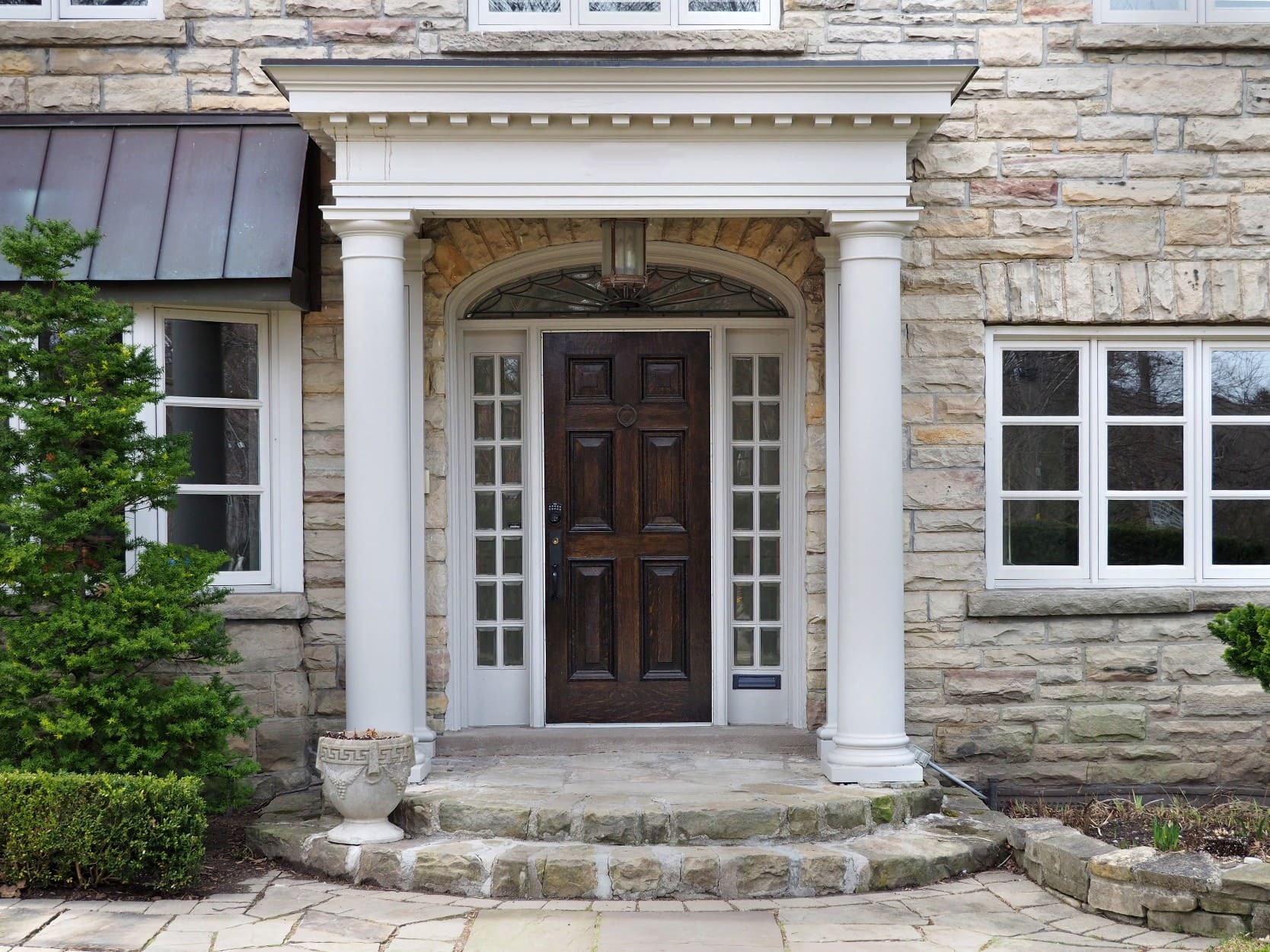 Front door of a stone house typical of real estate in West Wind, Lexington